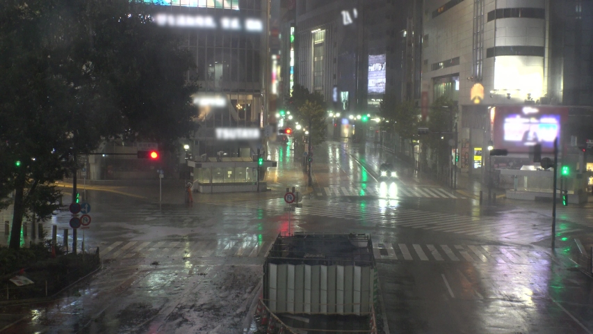 TOKYO, JAPAN - 12 OCTOBER 2019 : Powerful Typhoon Hagibis made landfall. Heaviest rain and winds in 60 years. View of Shibuya scramble crossing. Government issued highest level of disaster warning. Royalty-Free Stock Footage #1040892674