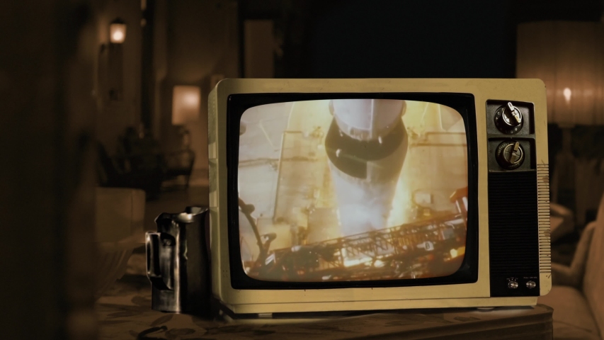 Apollo 11 Launch Seen on a Retro Television. Sepia Tone. Elements of this Video furnished by NASA. 4K Resolution.  Royalty-Free Stock Footage #1040910755