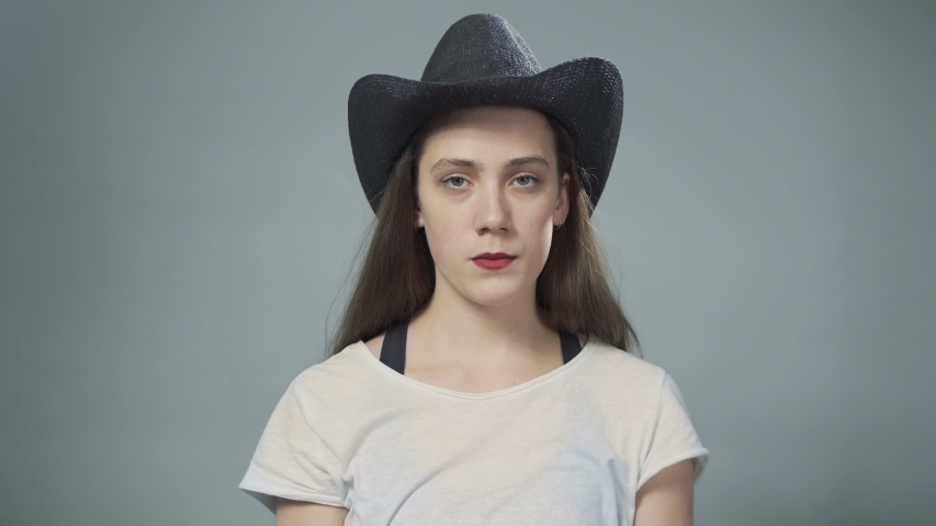 Video of young funny woman in cowboy hat