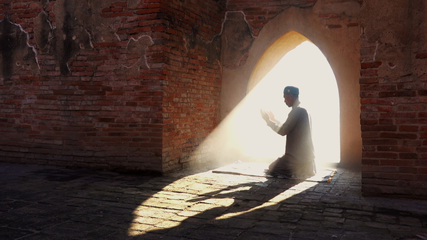 Muslim man praying at an old mosque in Phra Nakhon Si Ayutthaya Province, Thailand, Asian Muslims | Shutterstock HD Video #1040915843