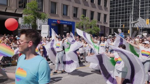 TORONTO, CANADA JUNE 23RD, 2019: Marchers Celebrate Gay Pride With White Wing Costumes