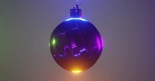Christmas ball with iridescent texture for holiday background with neon glow magic light effect. Xmas motion design with bauble