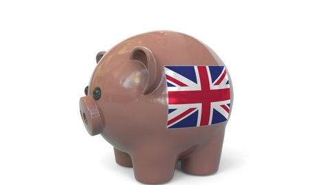 Putting money into piggy bank with flag of the United Kingdom. Tax system system or savings related conceptual 3D animation