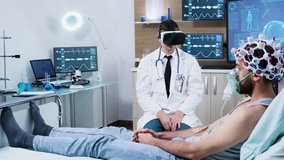 Doctor in a modern centre for brain analysis using vr headset while his patient lies in the hospital bed - Powered by Shutterstock - Get 15% off with code: PIKWIZARD15
