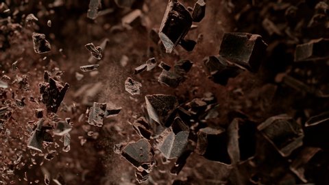 Super Slow Motion Shot of Raw Chocolate Chunks and Cocoa Powder after Being Exploded Towards The Camera at 1000fps.