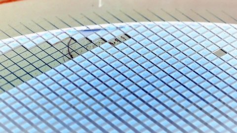 Slow motion video of Pick up silicon die in silicon wafer in semiconductor manufacturing