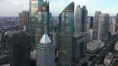 QINGDAO, CHINA – SEPTEMBER 2019: Aerial view of glass office towers and skyscrapers in modern business district in Qingdao, China