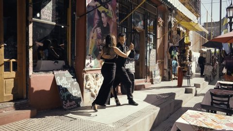 Buenos Aires, June 2019, a couple of tango dancers perform at the Caminito
