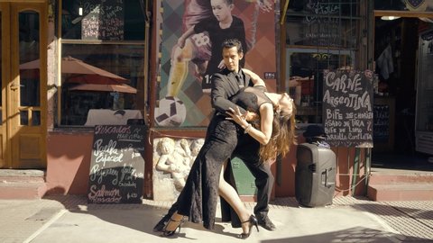 Buenos Aires, June 2019, a couple of tango dancers perform at the Caminito