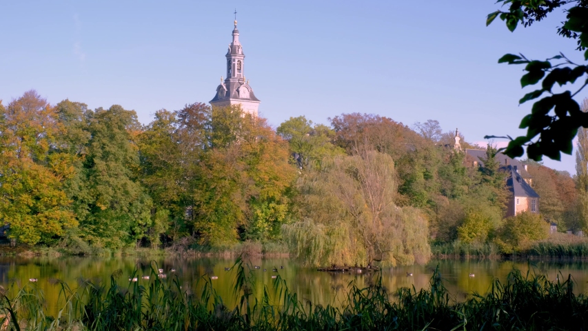 Lake and autumn trees in the Abdij van park in Leuven. Province of Flemish Brabant, Flanders, Belgium