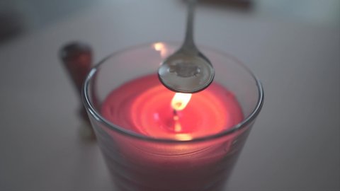 Seal melting, sealing wax with candlelight fire. 