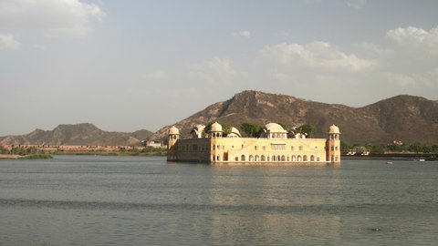 an afternoon pan of jal mahal palace and lake man sagar in jaipur, india