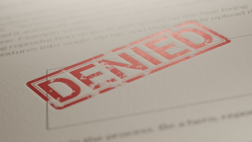 A document is being denied. Red office stamp slowly travels through the air and marks the paper with ink seal. Huge bureaucracy force is bending the dusty sheet of paper. Looping animation.
 Royalty-Free Stock Footage #1041006899