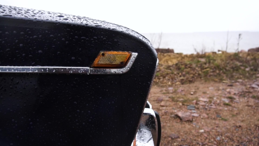 Close up footage of headlight of blue old retro car.