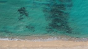 Aerial drone footage of ocean, surf and beach 