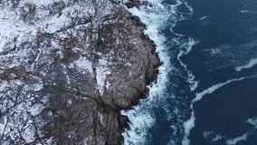 Big waves of arctic ocean aerial video. Drone view on blue epic ocean, clean water, breaking waves, whitewash. Ocean seascape, wildlife north pole, polar sea. Climate change and global warming.