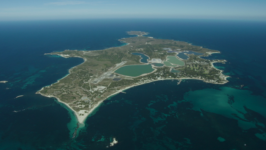 Aerial island view Rottnest landscape with salt lakes sandy bays and aircraft runway Perth tourist destination Western Australia