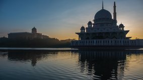 Time lapse of Putra Mosque in Putrajaya, Malaysia during the morning sunrise.