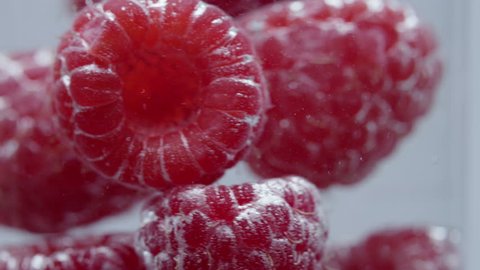 Raspberries in the water close up shot on 4K RED camera