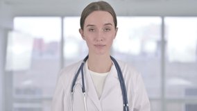 Portrait of Beautiful Young Female Doctor doing Video Chat