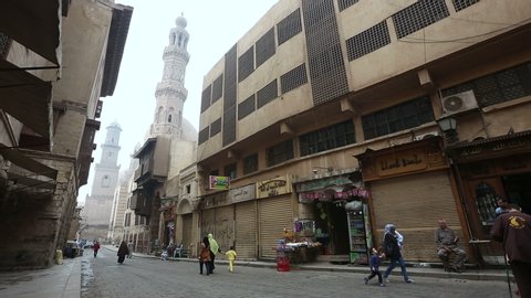 CAIRO, EGYPT - 2013: Pedestrians at Muizz street's. Muizz is one of the oldest streets in Cairo which has the greatest concentration of medieval architectural treasures in the Islamic world