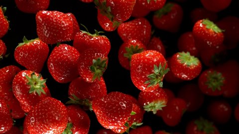 Super slow motion of strawberries isolated on black background. Filmed on high speed cinema camera, 1000 fps.