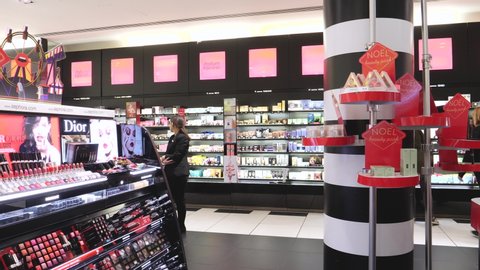 Paris, France - Circa 2019: Handheld video of customers shopping inside Sephora Cosmetics store for perfumes, shades, lipsticks and other beauty accessories