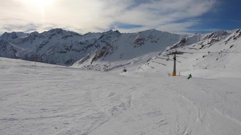 Ponte di Legno, Tonale, Italy. Skiing on the slopes in a wonderful day. POV from the skier. Point of view from the ski helmet. Italian Alps