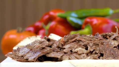Pan right on hot delicious beef shawarma plate, Turkish food, Arabic food, slow motion