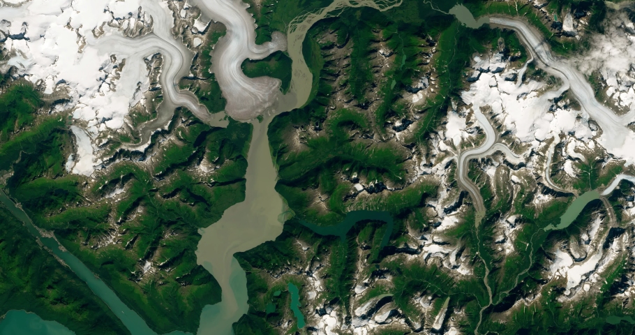 Very high-altitude overflight aerial of a rapidly receding Taku Glacier, Alaska