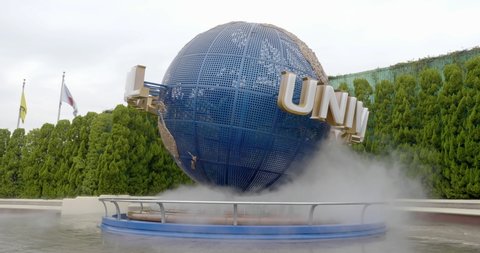 Osaka / Japan - 02 21 2019: Osaka, Japan, Circa – Universal studios Japan “USJ” spinning globe with mist flowing from base.