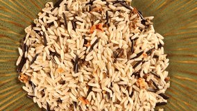Wild rice pilaf 4k video spinning clockwise slowly top down view