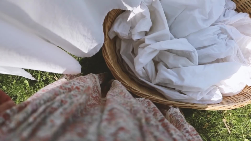 a basket of laundry in the garden, white laundry, white clothes