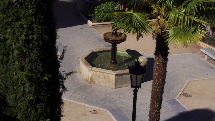 Salamanca / Spain - May 29 2019: a beautiful old fountain with clear water in the centre of a quiet pretty square plaza in the centre of Salamanca in Spain. 