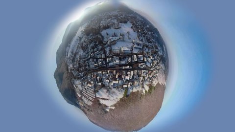 The city Badenweiler as little Planet. Flying along the town with a 360 Camera.