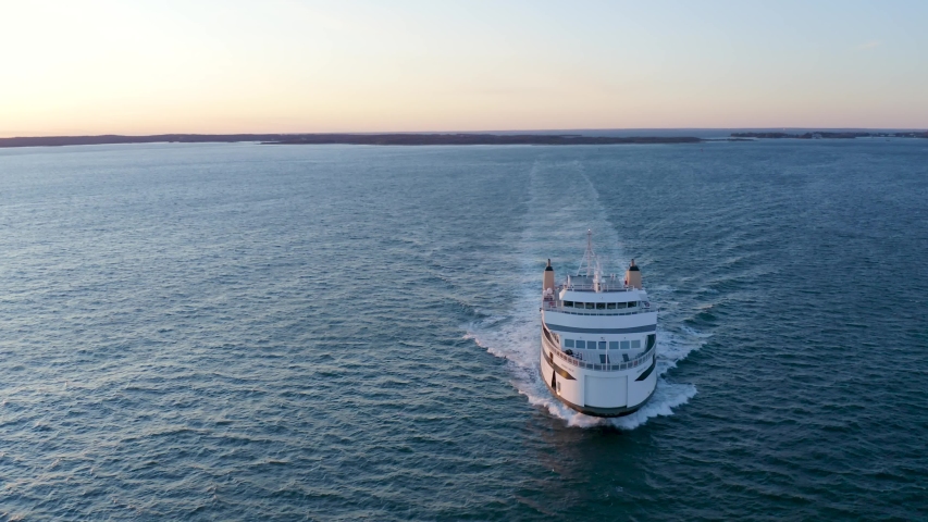 Sweeping Aerial of Car Ferry off the Coast of Massachusetts at Sunset from Drone