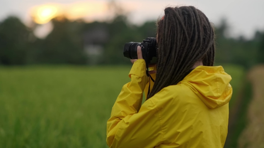 Portrait happy woman taking pictures with vintage camera sunlight travel girl spring beautiful attractive fun photography modern photographing close up tourist vacation fashion cheerful young