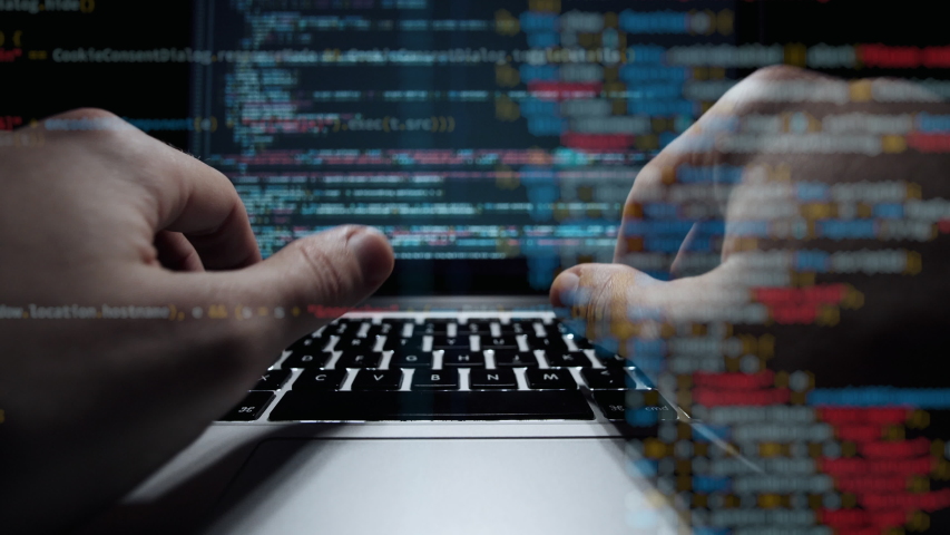Cinematic close up of hands typing code on a keyboard with Multiple layers of codes and programmer shown beneath them. Hacking programming concept. | Shutterstock HD Video #1041202975