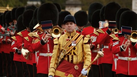 LONDON, circa 2019 - Close-up of the musicians of the foot guards marching along Buckingham Palace in London, England, UK