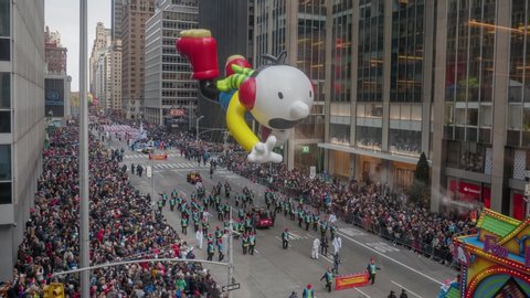 NEW YORK CITY - NOVEMBER 2016: Timelapse of the 90th Annual Macy's Thanksgiving Day Parade marching on 6th Avenue with The Trolls, Wiggle Worm, Wimpy Kid, Felix the cat and others in New York City, US