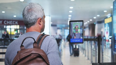 airport security check man get through ai facial recognition control system