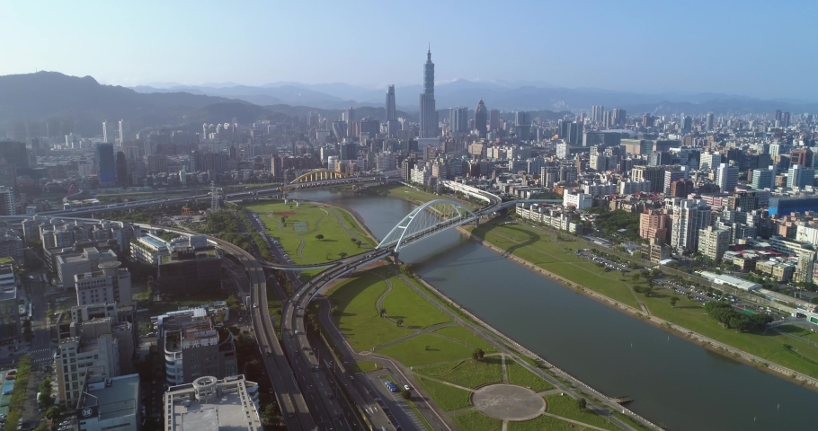 Aerial shot of central Taipei city with Rainbow bridge and Keelung river at dawn, Taiwan Royalty-Free Stock Footage #1041243658