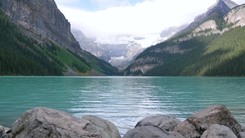 Lake Louise, a glacially-fed lake in Banff National Park in 4K. A View of Lake Louise near Banff, Alberta 4K. Summer natural landscape view