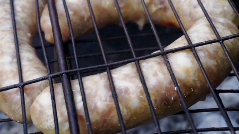 delicious juicy meat sausages fried on a lattice.close-up