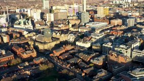 Aerial footage of the Leeds Town Centre at Christmas time showing the Christmas Ferris wheel and lights near the Leeds Town Hall in the heart of the Leeds City Centre in West Yorkshire UK