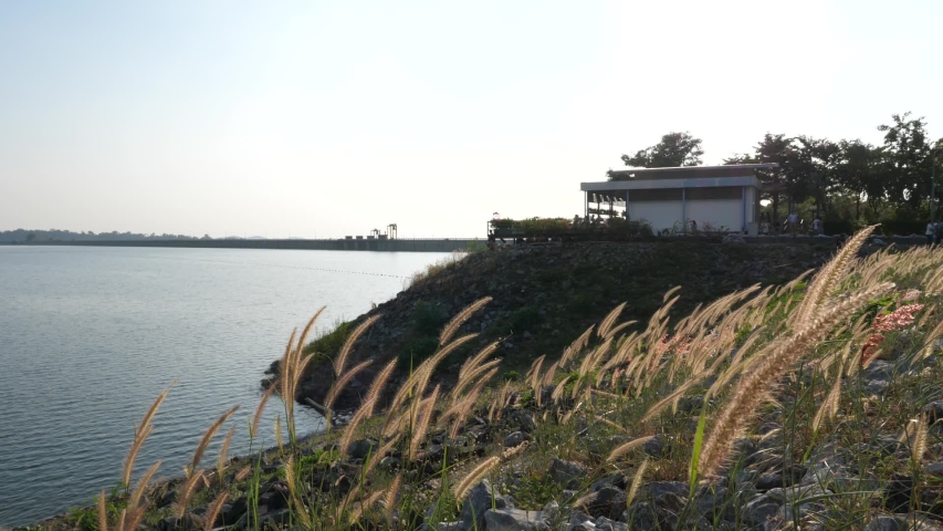 View of the dam, there is a restaurant and flower fields around the dam