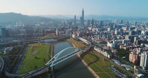 Aerial shot of central Taipei city with Rainbow bridge and Keelung river at dawn, Taiwan
