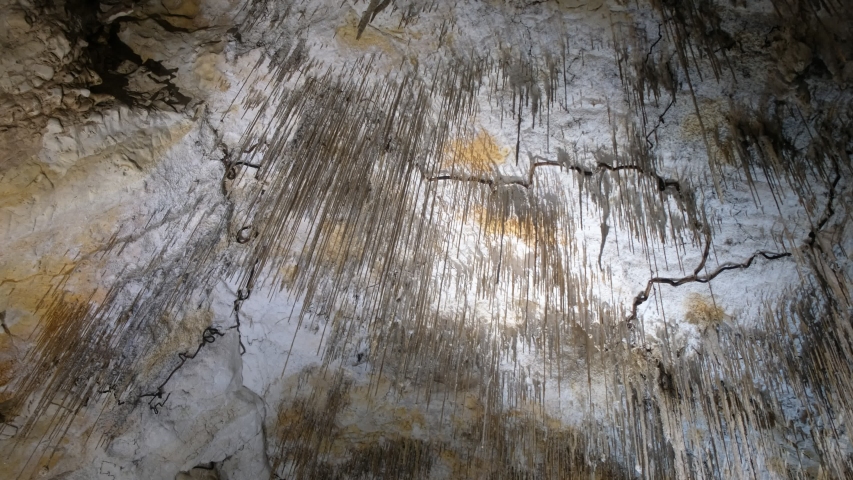 Stalactites and stalagmites in the cave of Provence. Tourist France.
