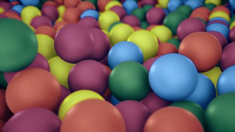Pile of gumballs closeup with colorful rolling and falling balls. Multicolored spheres in pool for children fun abstract background. Bright 3D animation with depth of field. Camera zooms out