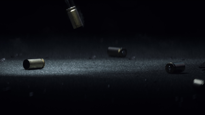 Sleeve Bullet Metal Slot on Dark Gray Asphalt Smoke Coming From the Bullets, Slow Motion, the Sleeve After the Shot, the Bullet Falls and Jumps on the asphalt, Night. Royalty-Free Stock Footage #1041327919